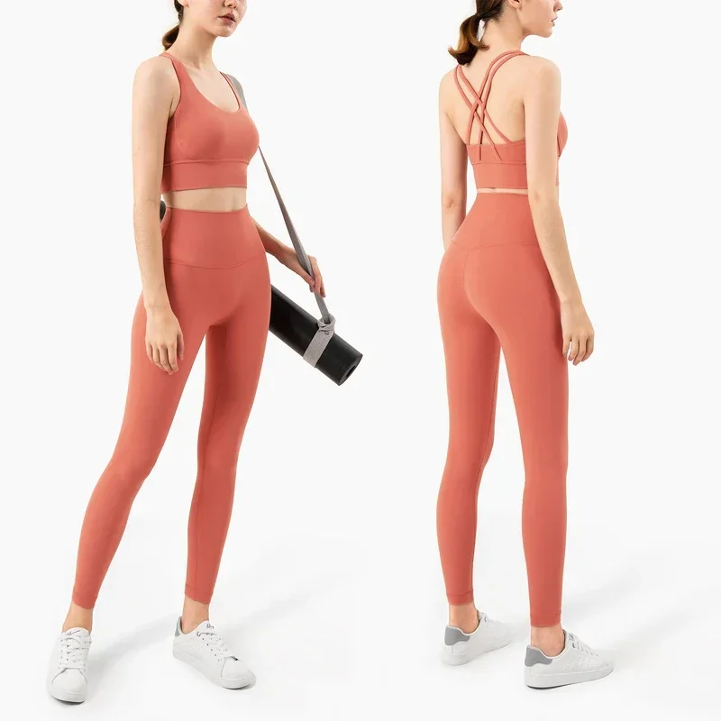 Pilates Yoga Leggings - ชุดโยคะผู้หญิงสีพื้น 2 ชิ้น ชุดบราโยคะไขว้หลังแบบกระชับสูง กางเกงเลกกิ้งเอวสูงยกสะโพก ชุดออกกำลังกายสำหรับวิ่งและฝึกซ้อม